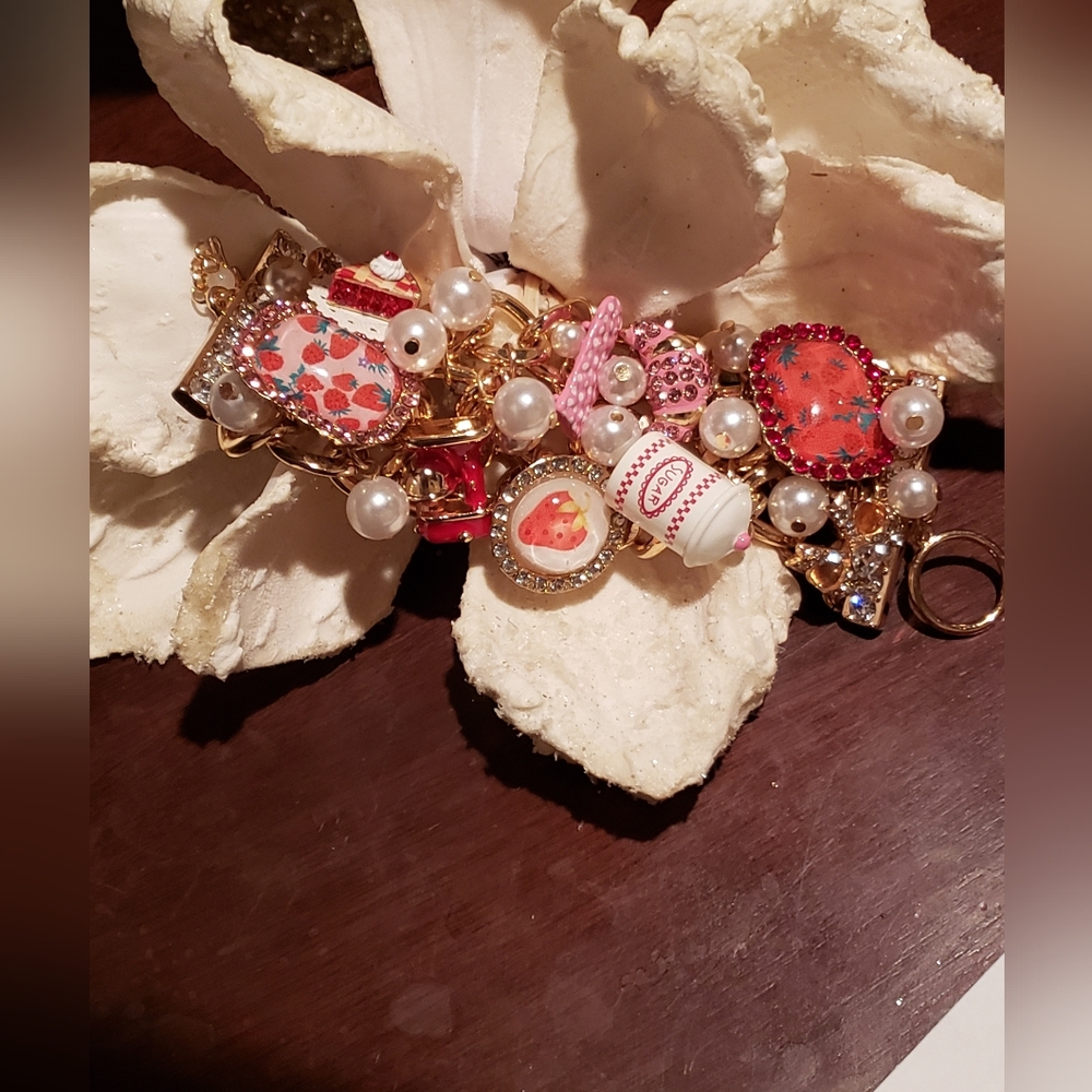 Betsey Johnson Babycakes Cluster Gold Tone Bracelet in Reds, Pinks and White.